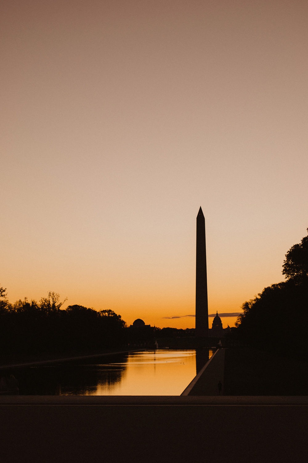 The Washington Monument at sunrise by Reflecting Pool