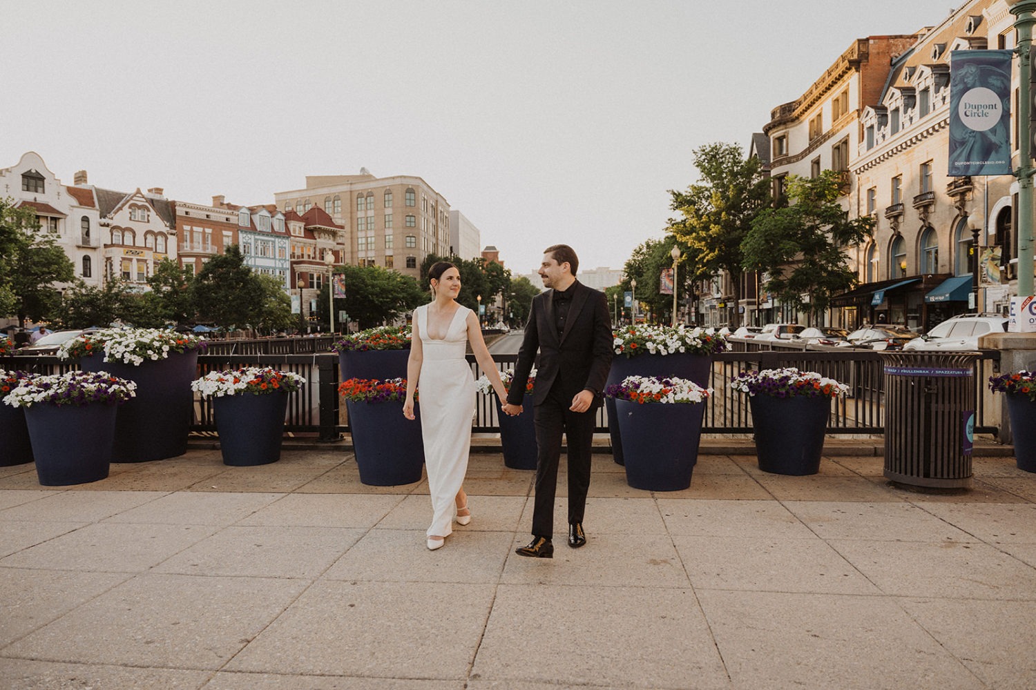 Couple walks across bridge in Dupont Circle