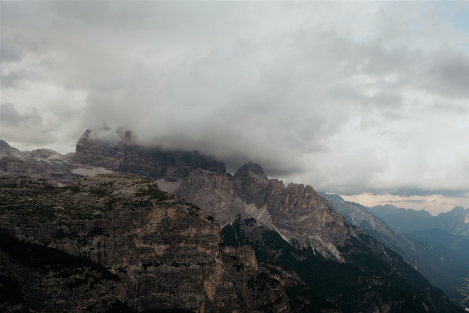 Dolomites covered by clouds in Italy captured by destination wedding photographer