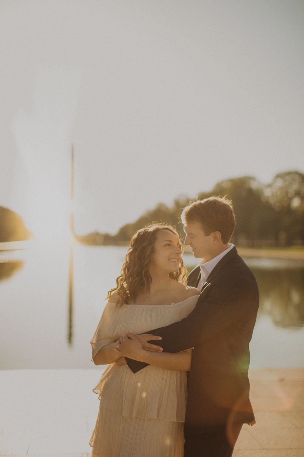 DC engagement photographer captures couple embraces by Reflecting Pool