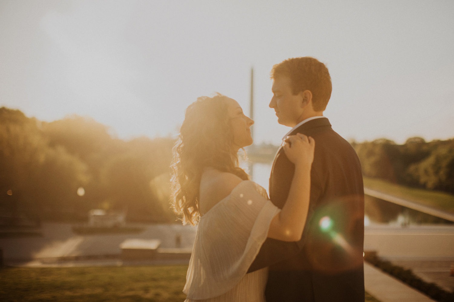 Couple embraces at sunrise captured by DC engagement photographer
