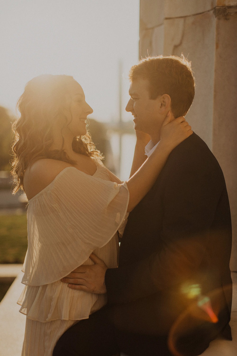 DC engagement photographer captures couple embracing at sunrise