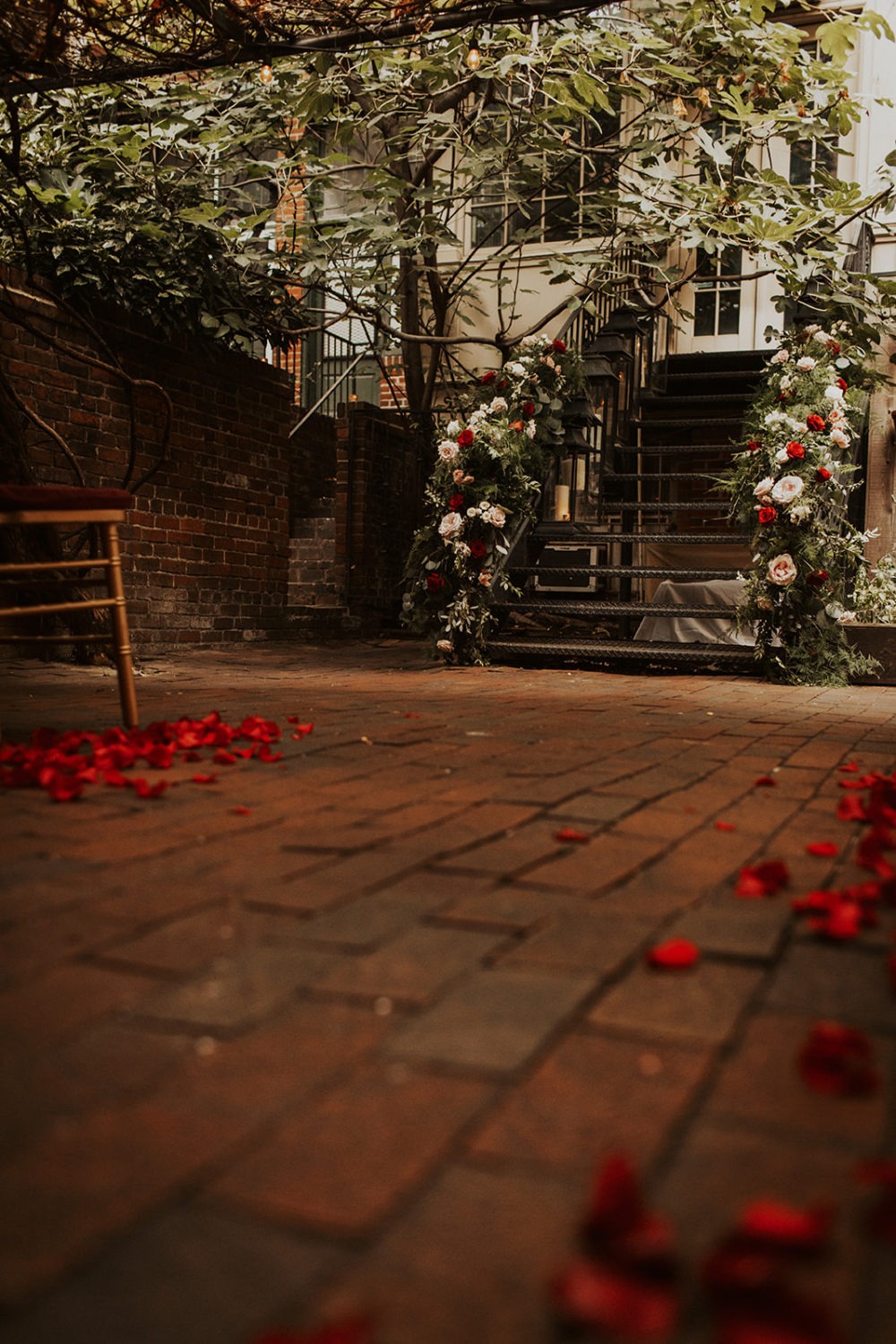 Flower petals decorate the ground at Iron Gate Restaurant: one of the best wedding venues in dc