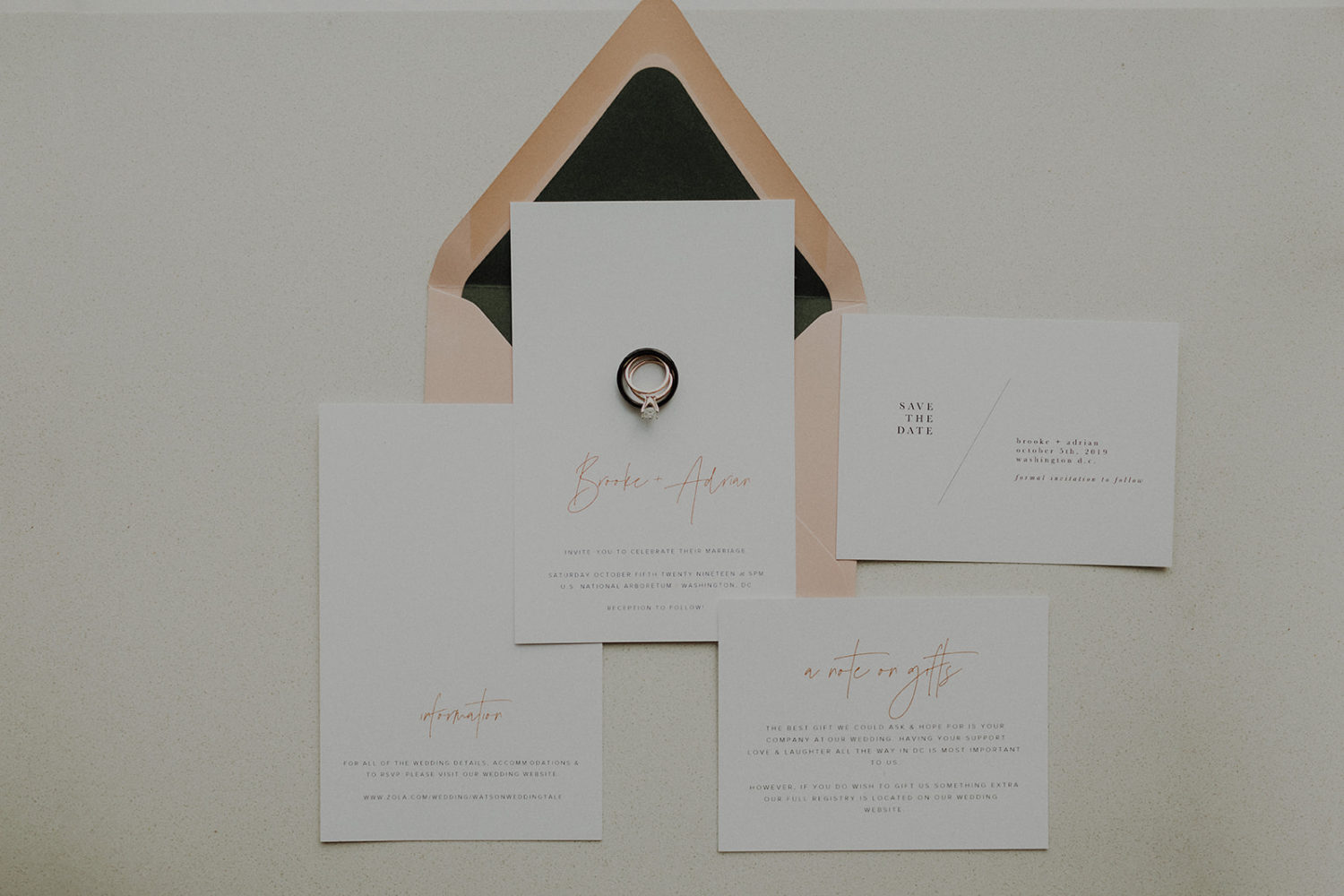 Wedding invitation suite with wedding rings as part of tips for how to plan a wedding on a budget