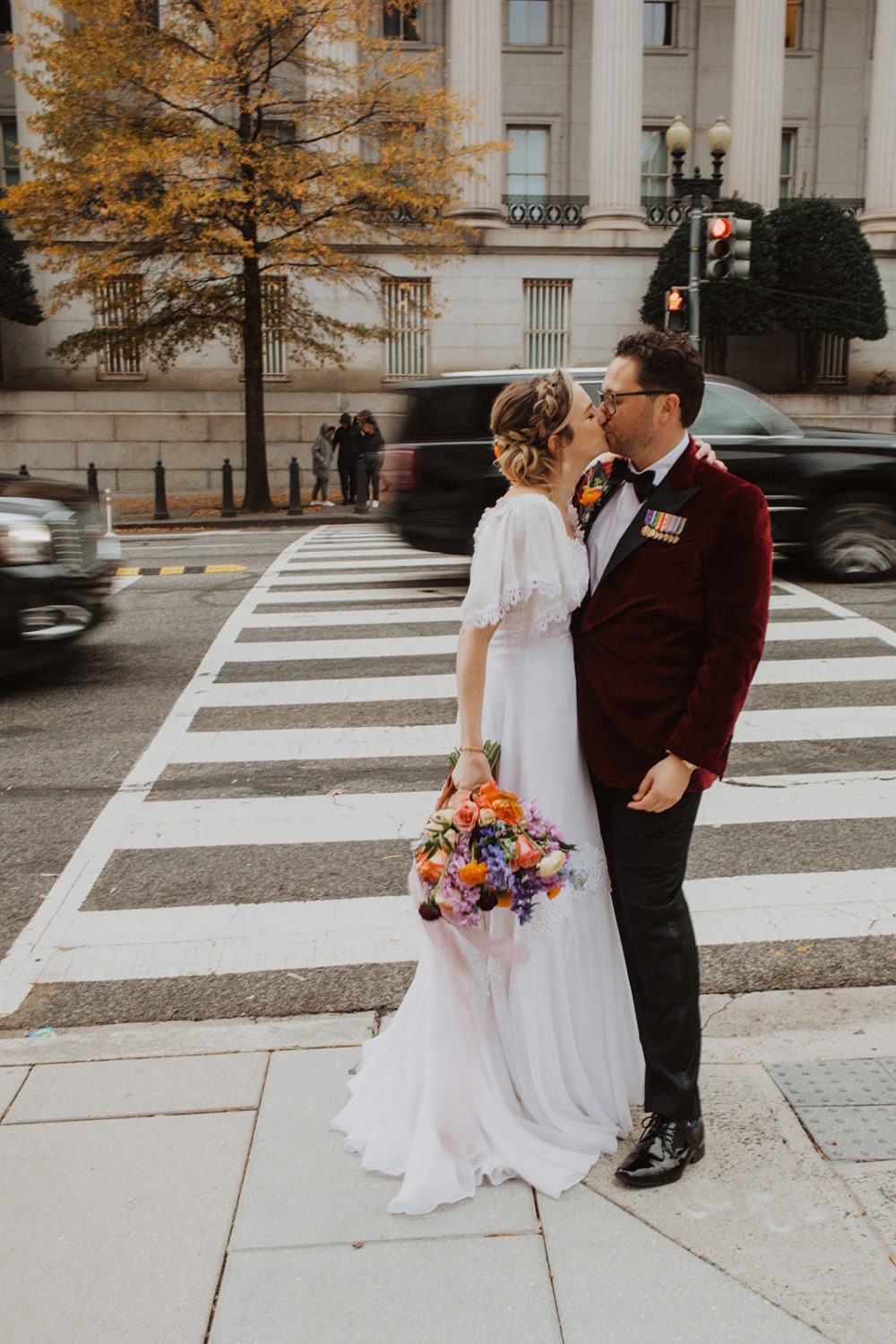 Couple kisses in city streets at Hotel Washington, Washington DC wedding