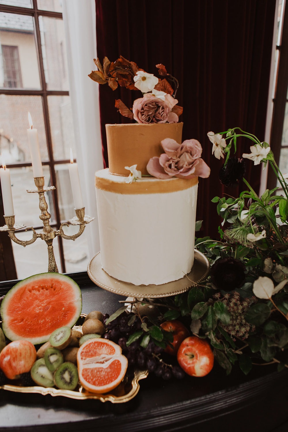 Wedding cake and fruit as decor tips for how to plan a wedding on a budget