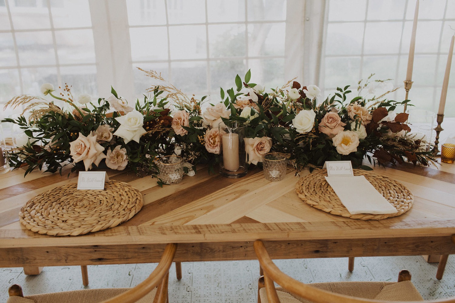 Wedding florals decorate wedding reception head table