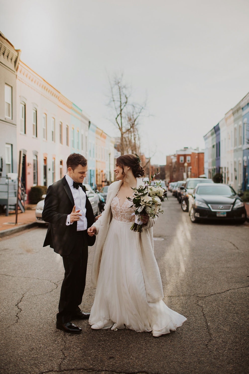 Couple stands in DC street at adventure elopement