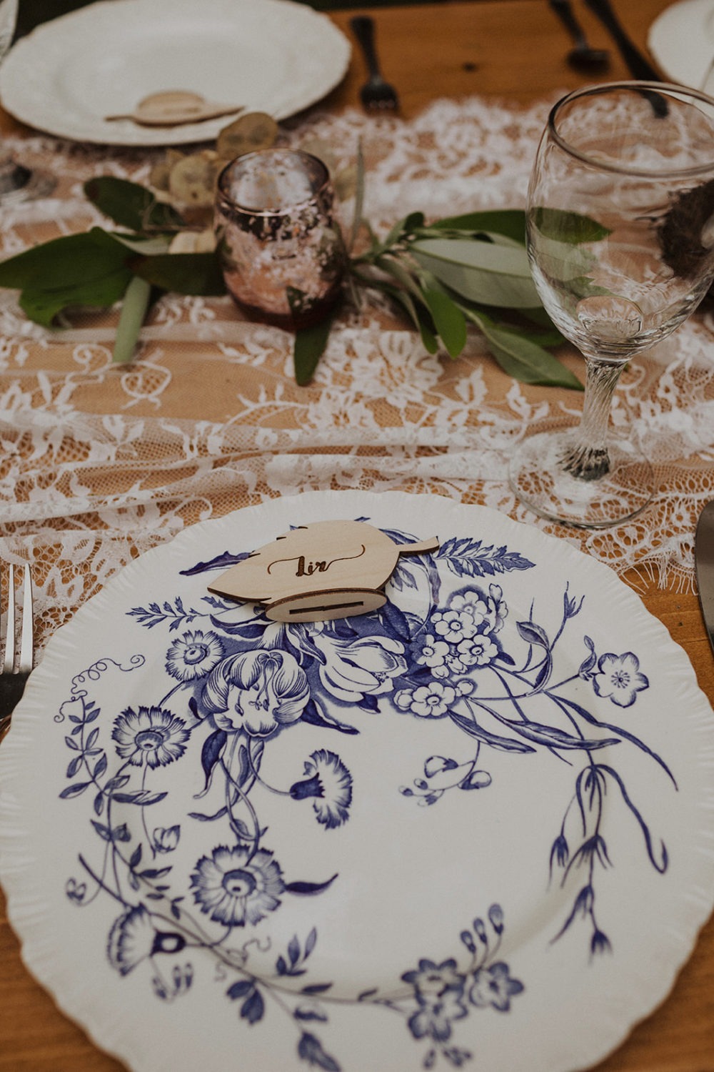 Wedding reception table setting with floral plate