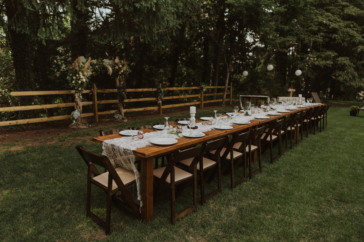 Table setting on backyard wedding reception table
