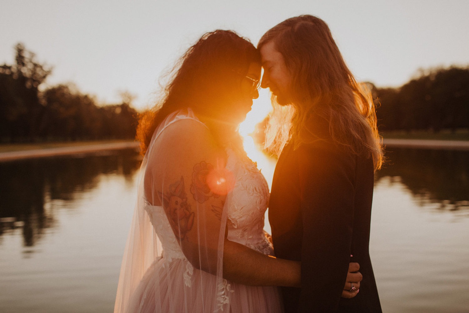 Couple embraces during Reflecting Pool sunset elopement