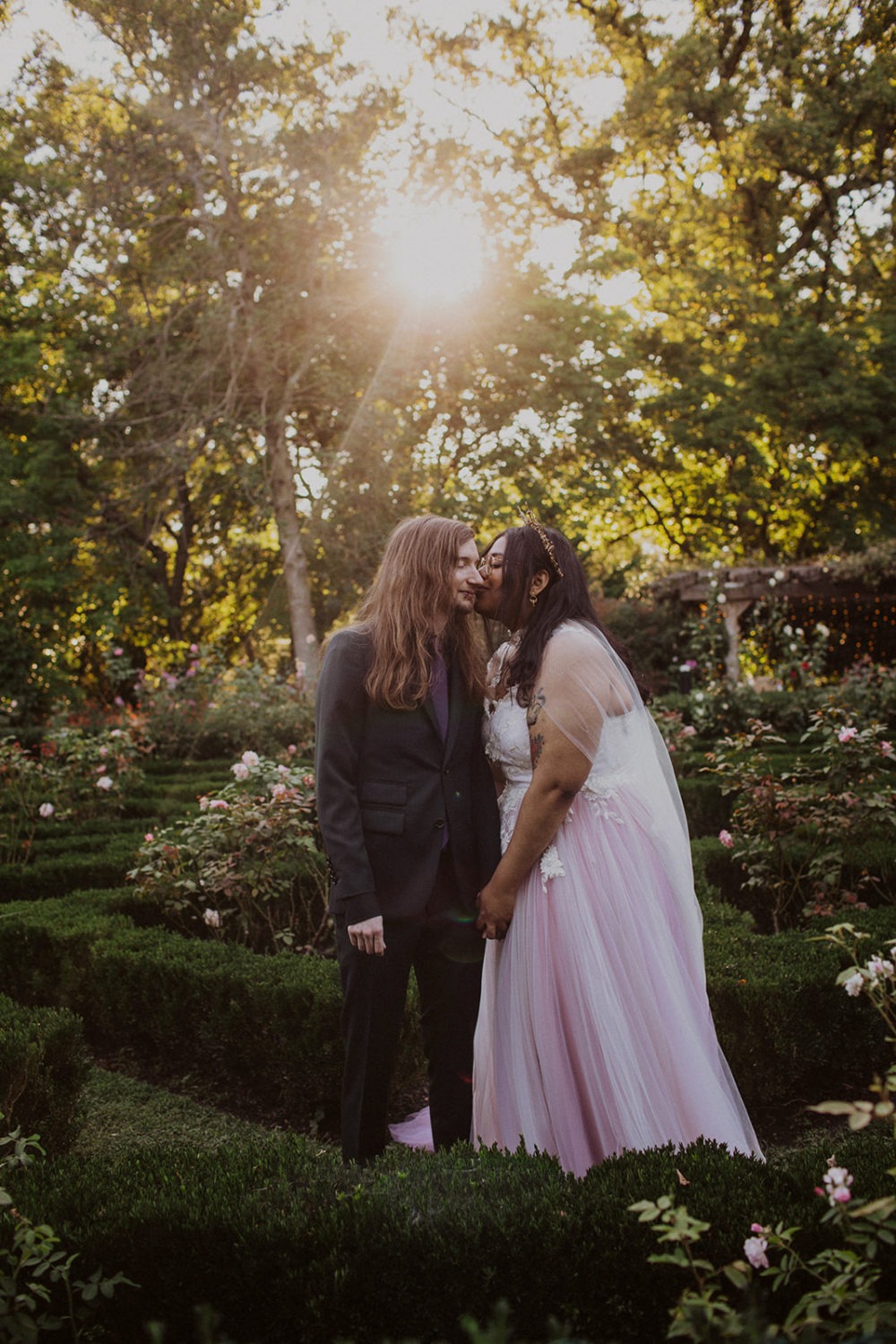 Couple kisses at sunset DC garden wedding