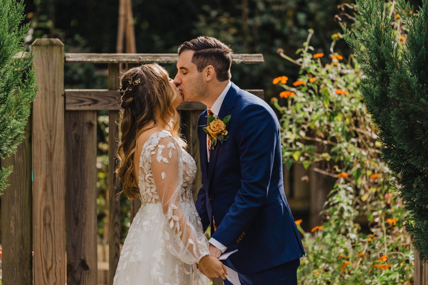 Couple kisses after vows during wedding first look