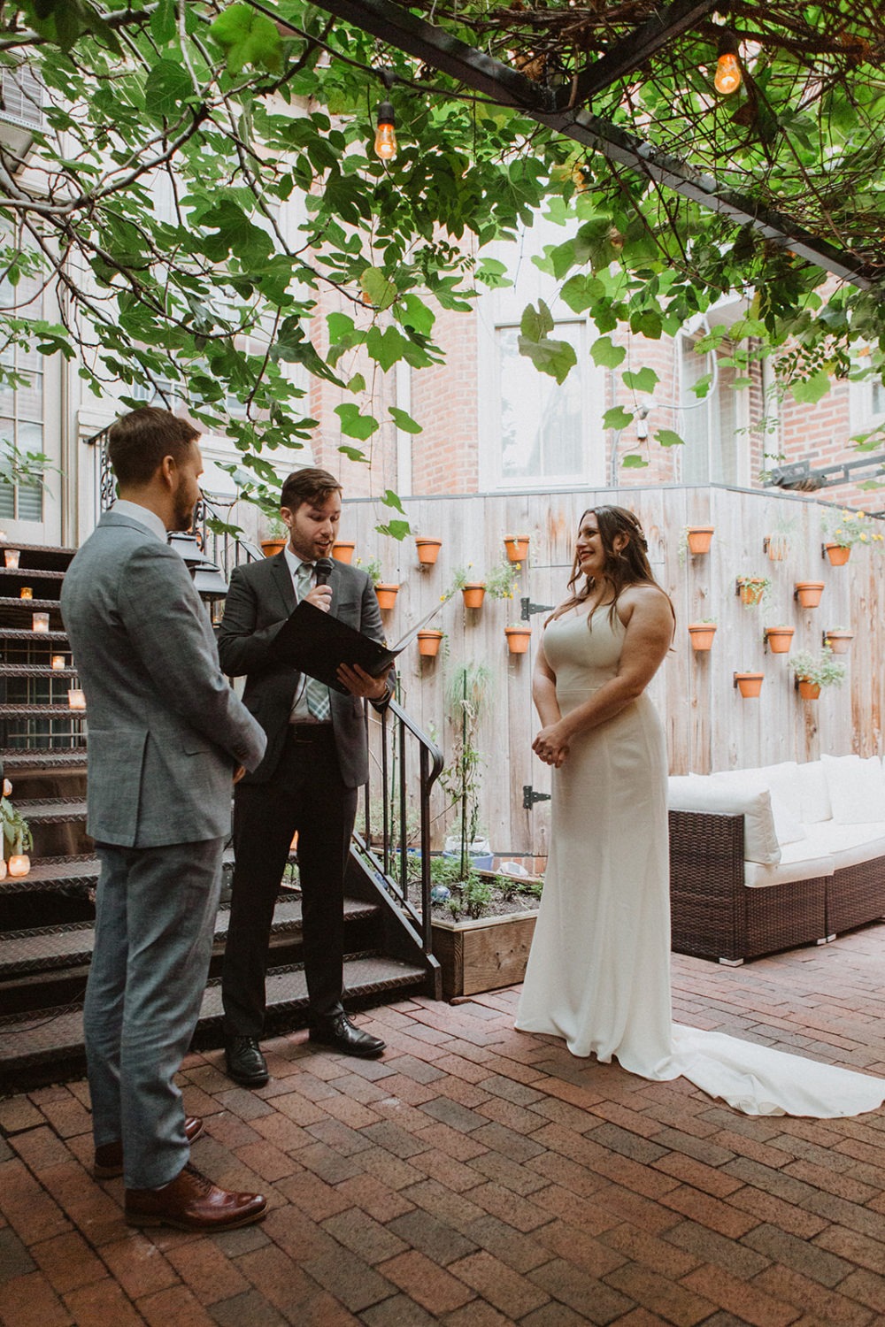 Couple exchanges vows at garden DC restaurant wedding 