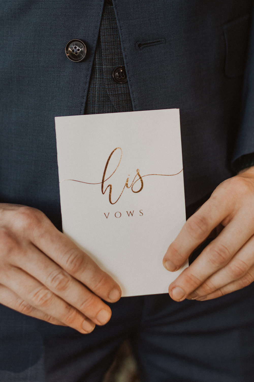 Groom holds a his vows book