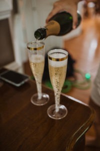 Champagne poured into glasses at wedding