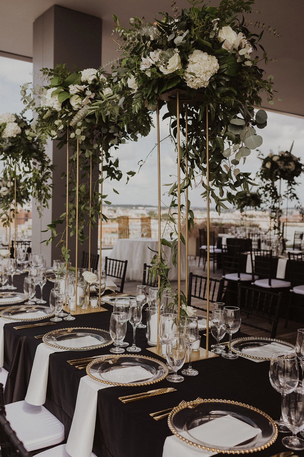 white flowers on gold decor with black tablecloth