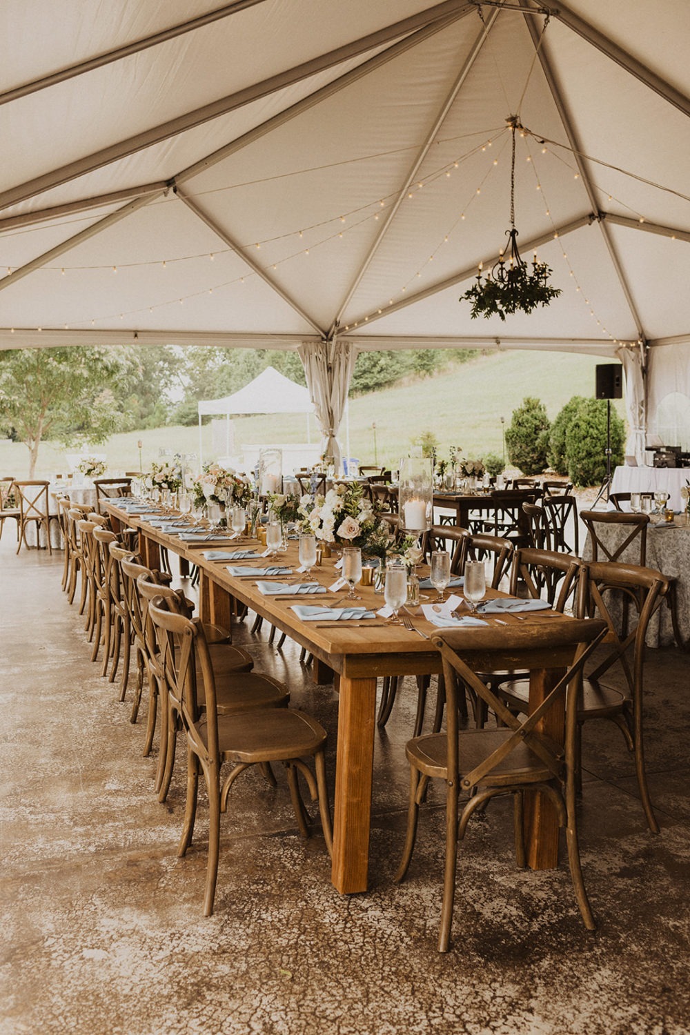 floral decor at tented wedding reception