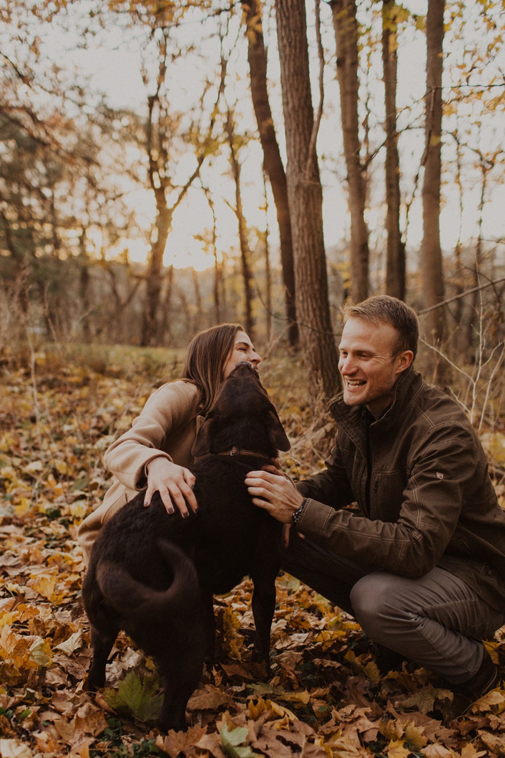 dog kisses couple at fall engagement photos session