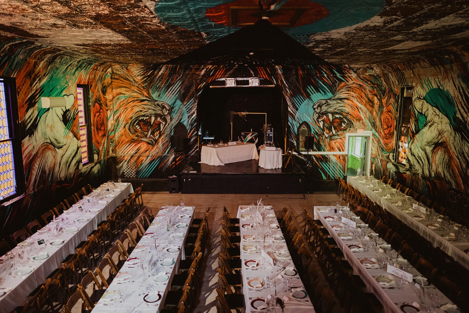 Culture House DC wedding reception design with lion painting on wall