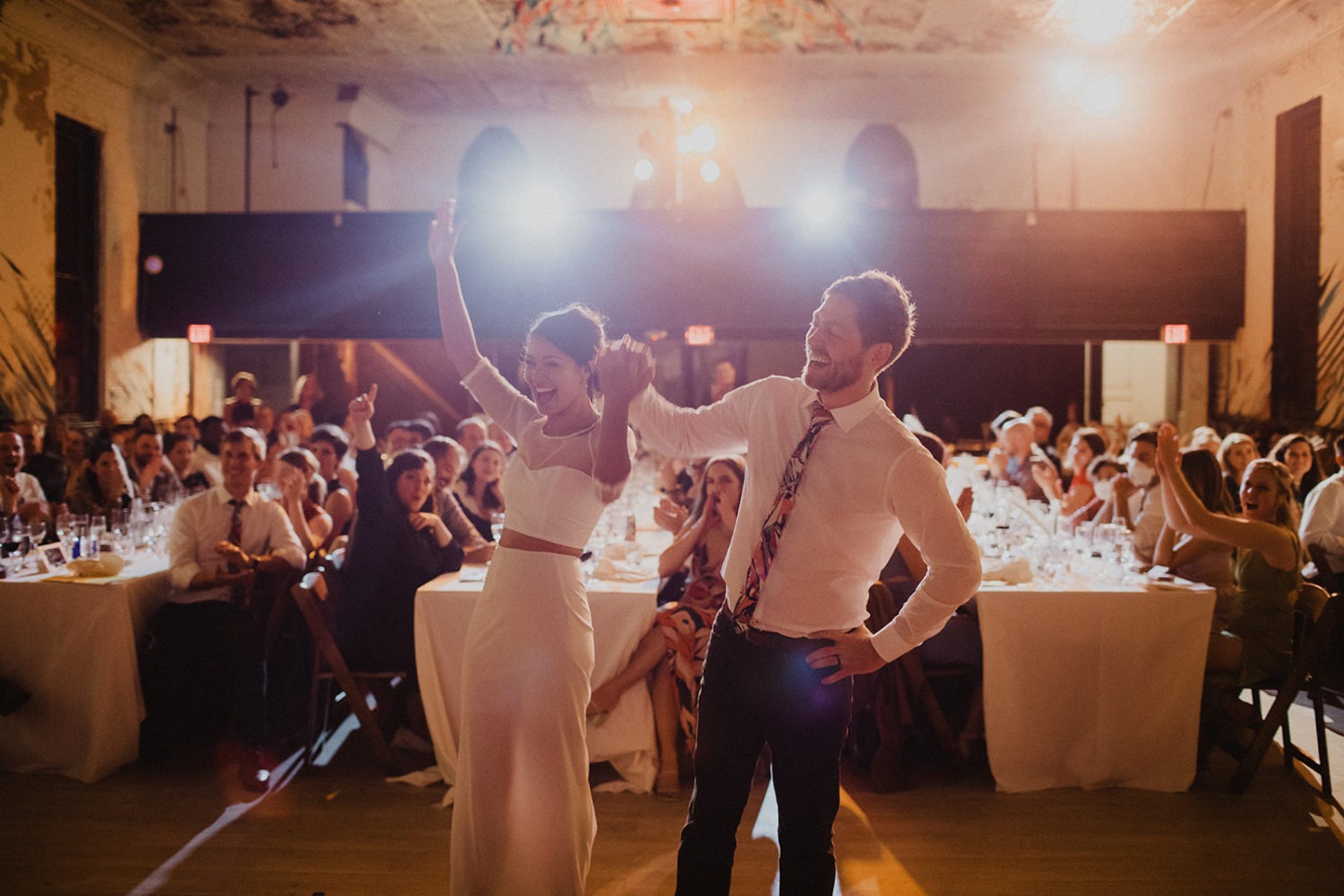 couple cheers during wedding reception at Culture House DC wedding venue