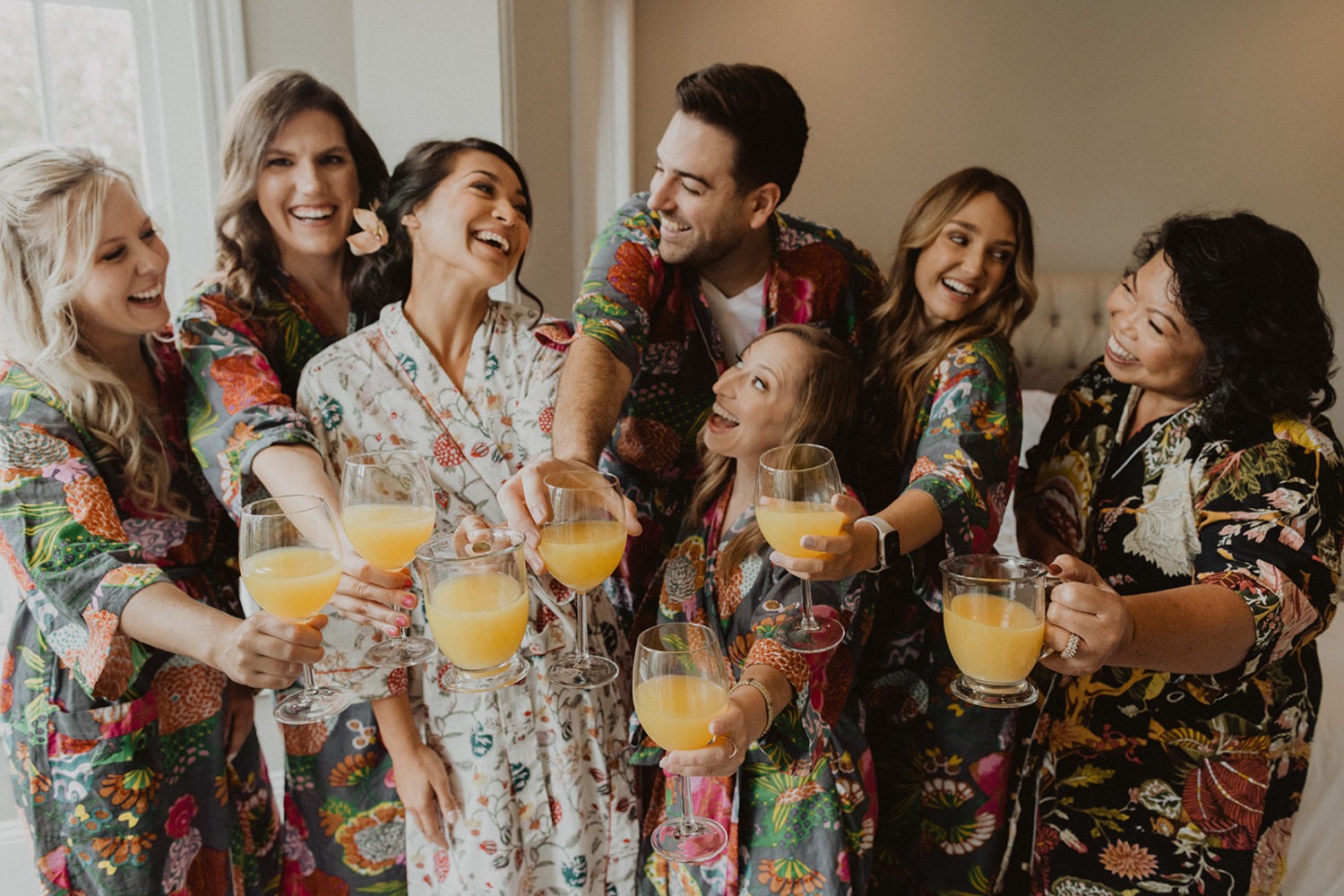 bridesmaids cheers with bride wear matching silk robes