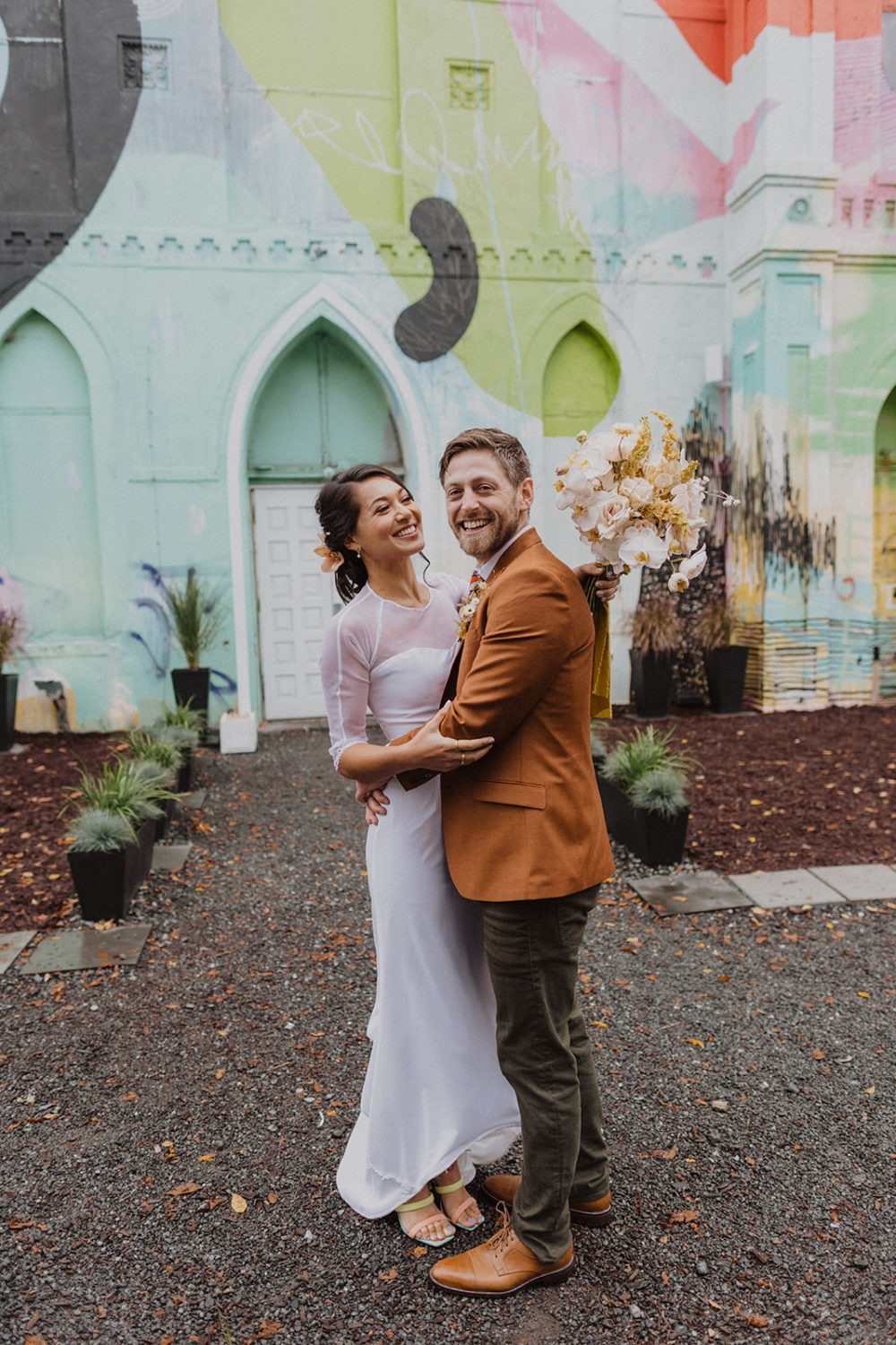 couple embraces in front of Culture House DC wedding venue