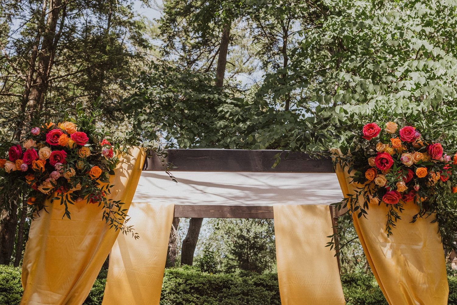 wedding canopy decorated with wedding flowers
