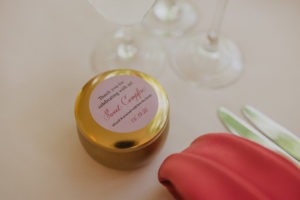 handmade candle as wedding favor on reception table