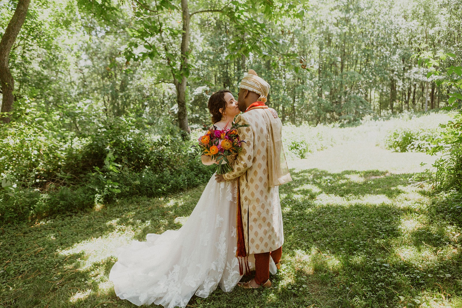 couple kisses at tree grove Maryland wedding venue