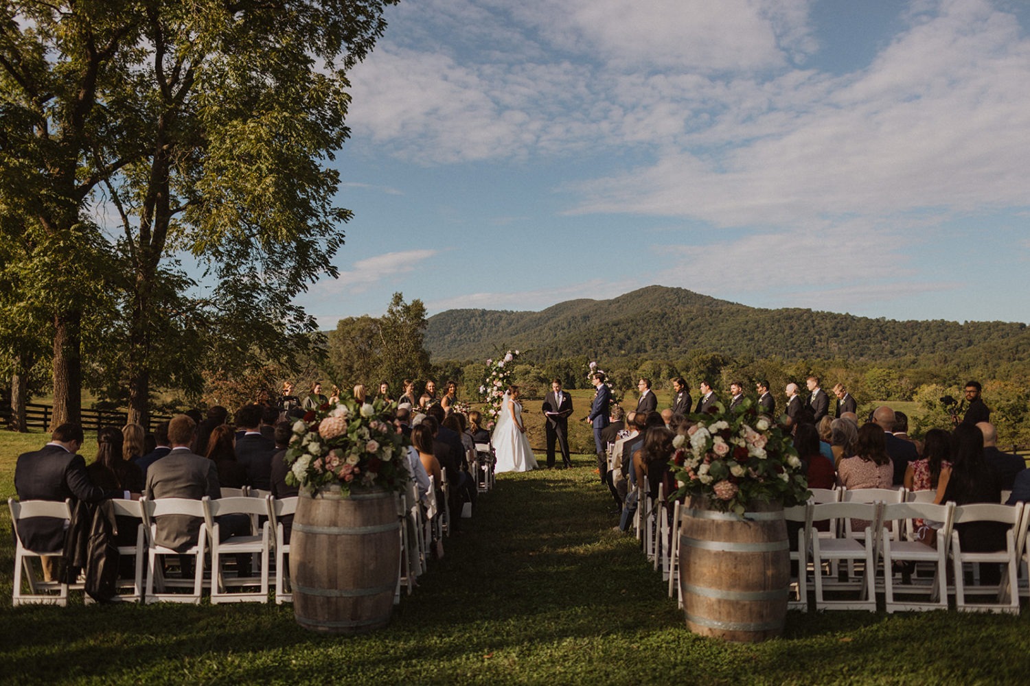 couple exchanges vows at sunset Virginia wedding ranch venue