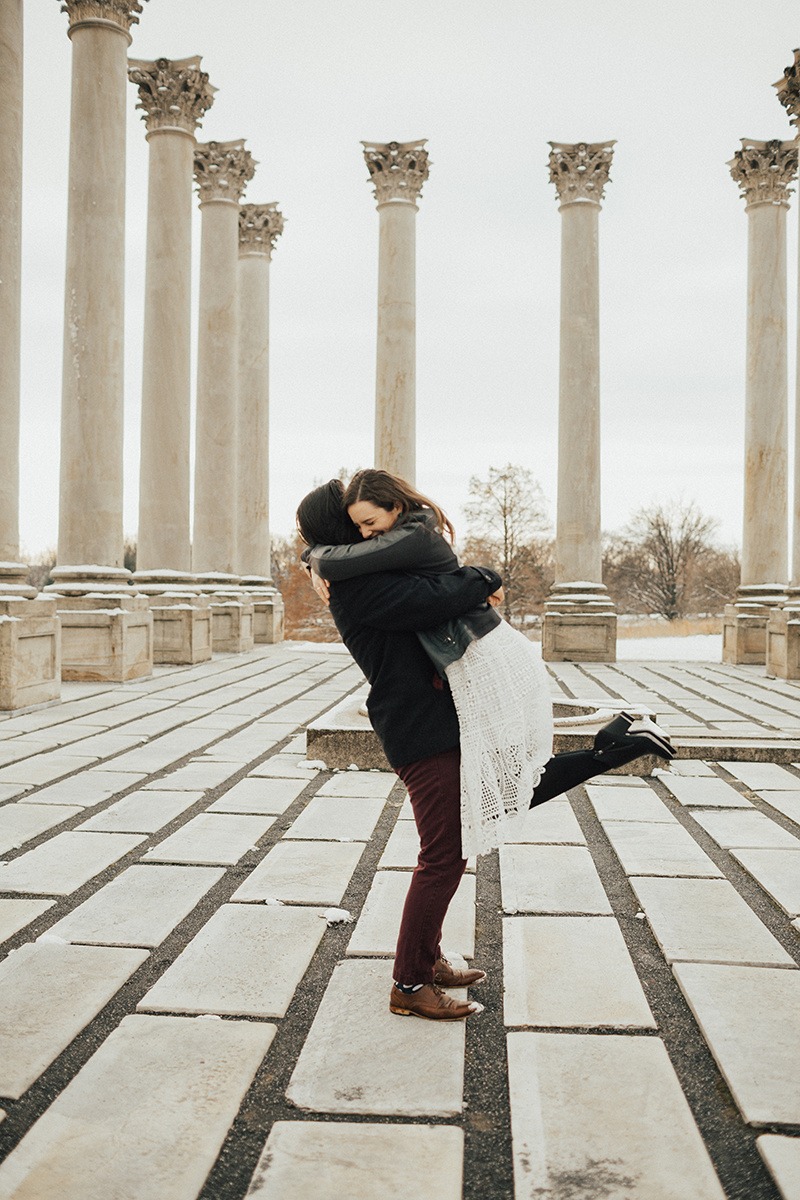 couple dances in National Columns at  winter engagement session