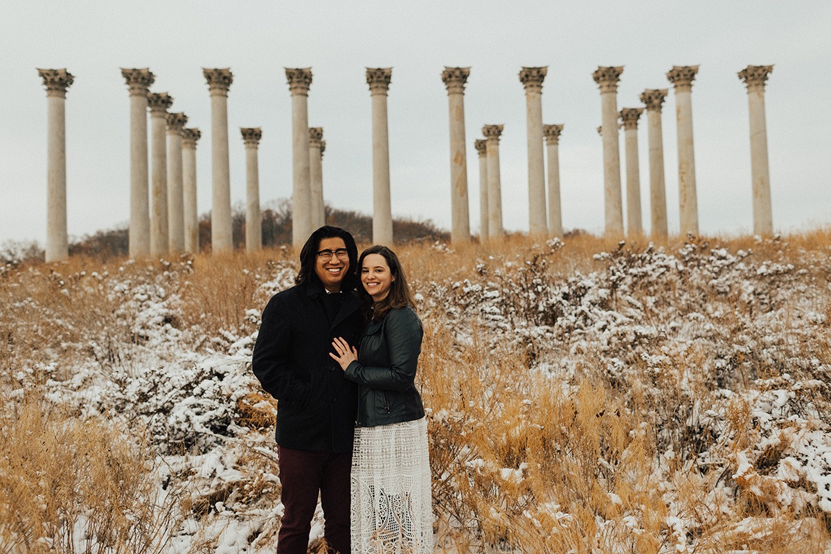 couple poses in front of National Columns at National Arboretum winter engagement session