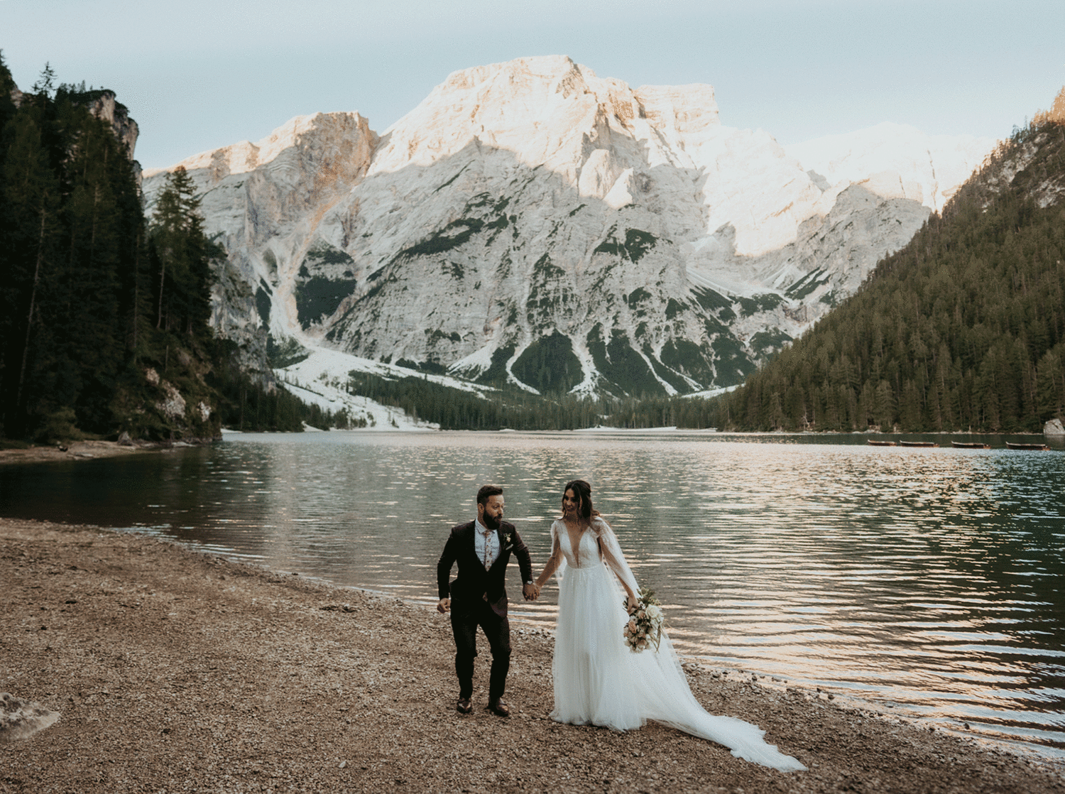 couple jumps into air at Dolomites Italy elopement 
