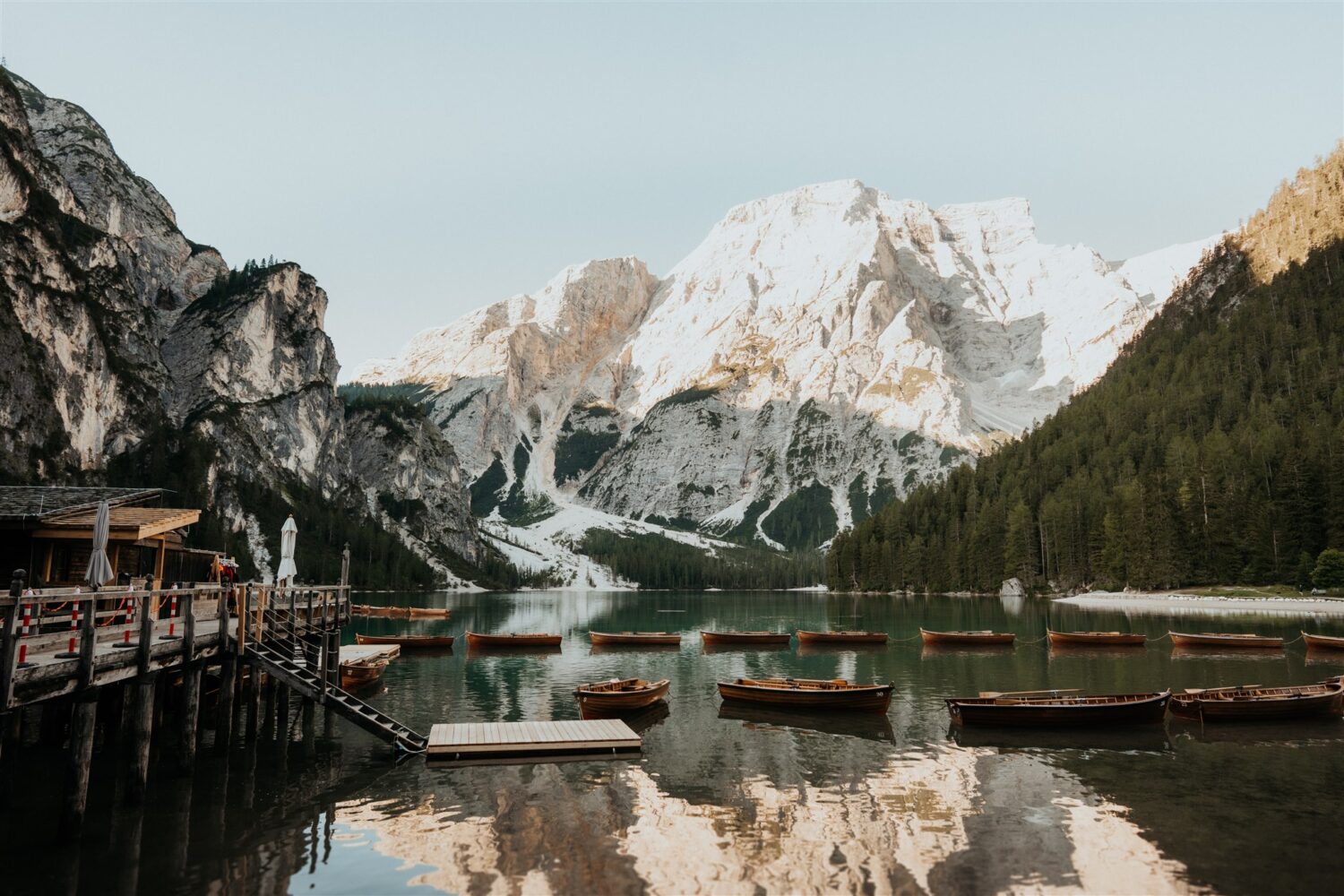 harbor of boats in lake beside the Italian Dolomites