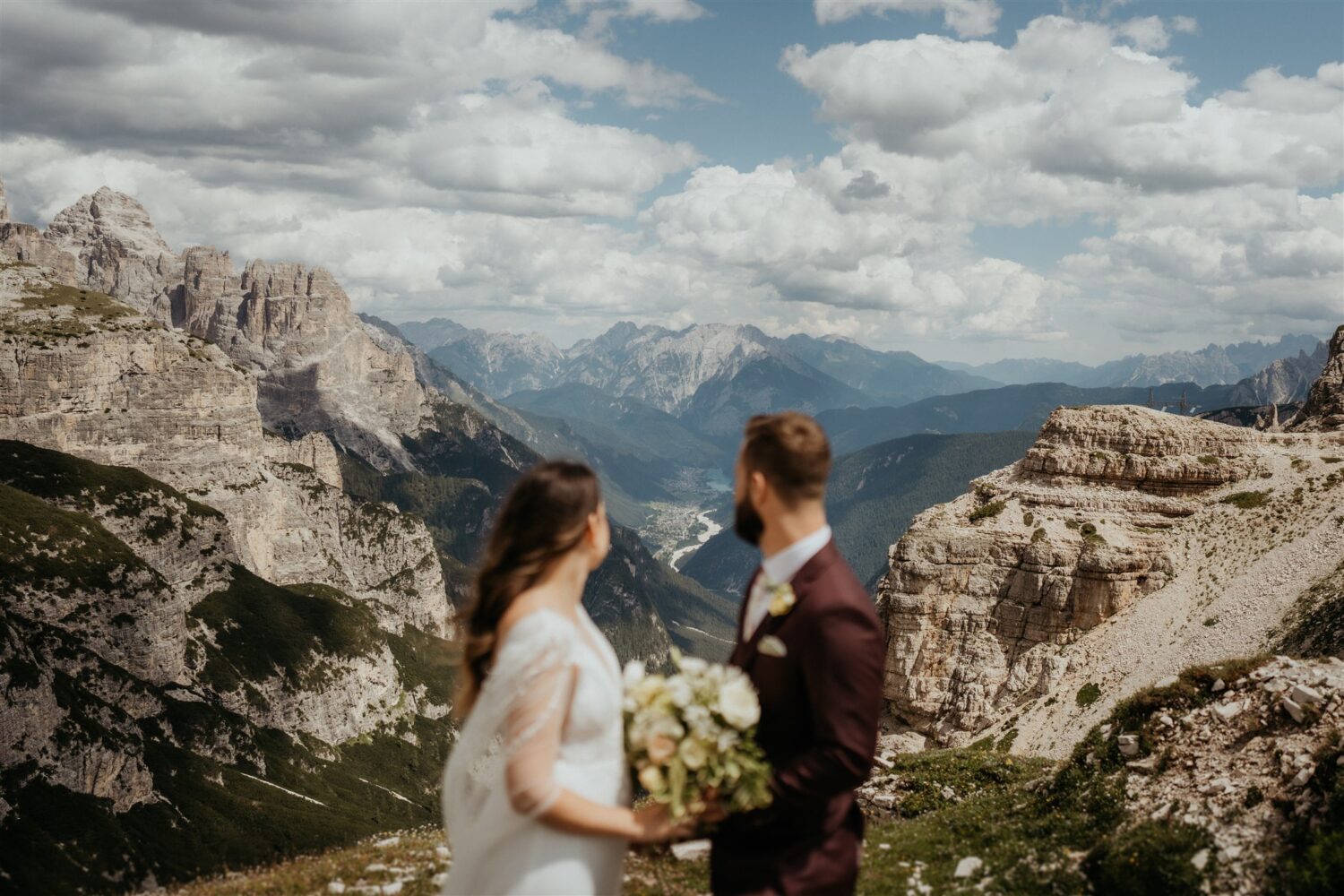 couple stands on mountaintop at the Italian Dolomites