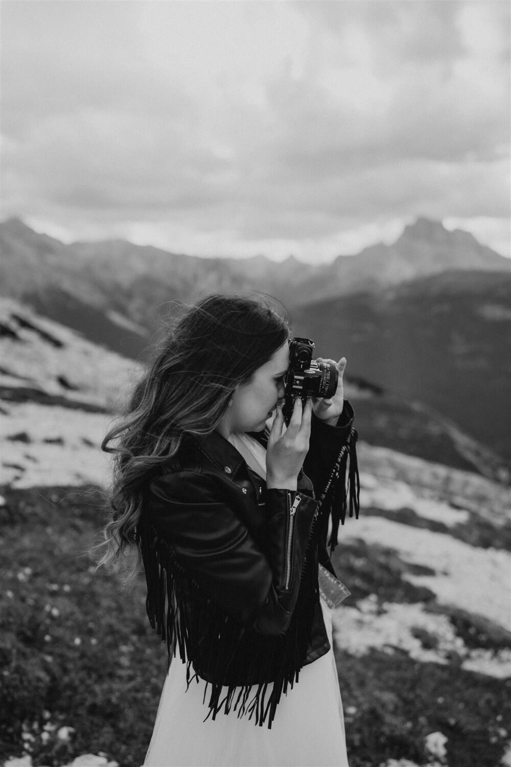 photographer takes film photographs at the Dolomites