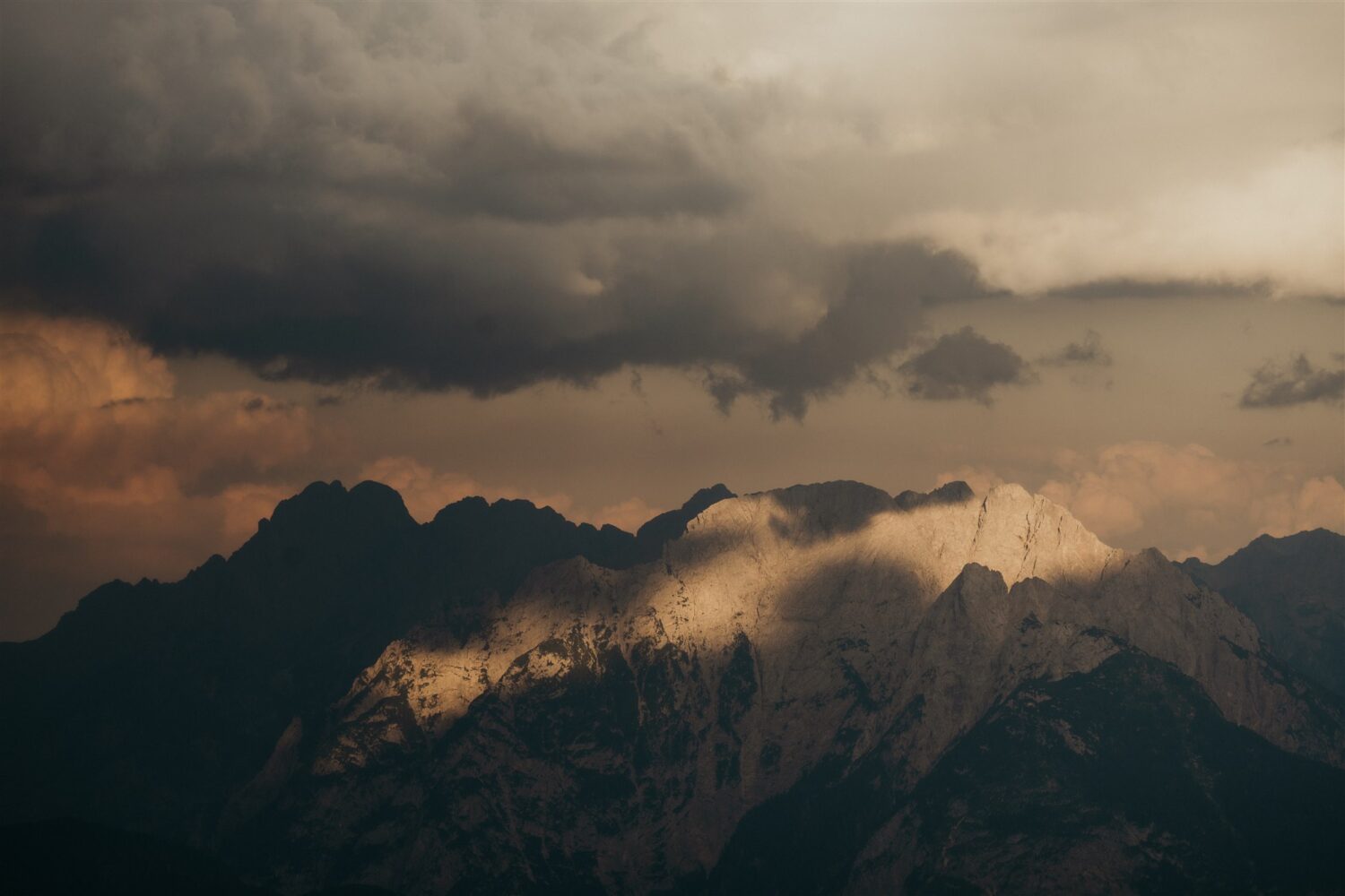 stormy cloudy sunset over the Italian Dolomites