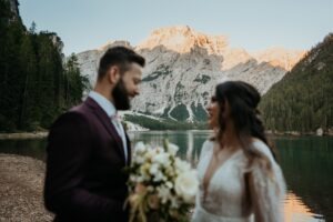 couple stands in front of the Dolomites at Italy elopement