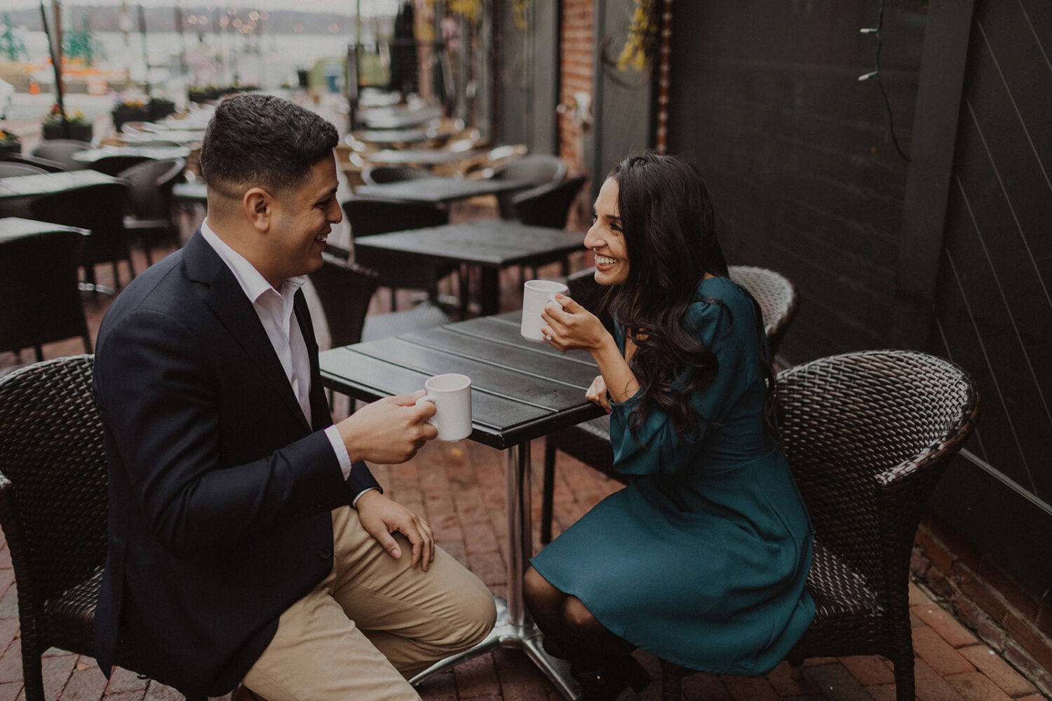couple sits coffee at Old Town Alexandria engagement session