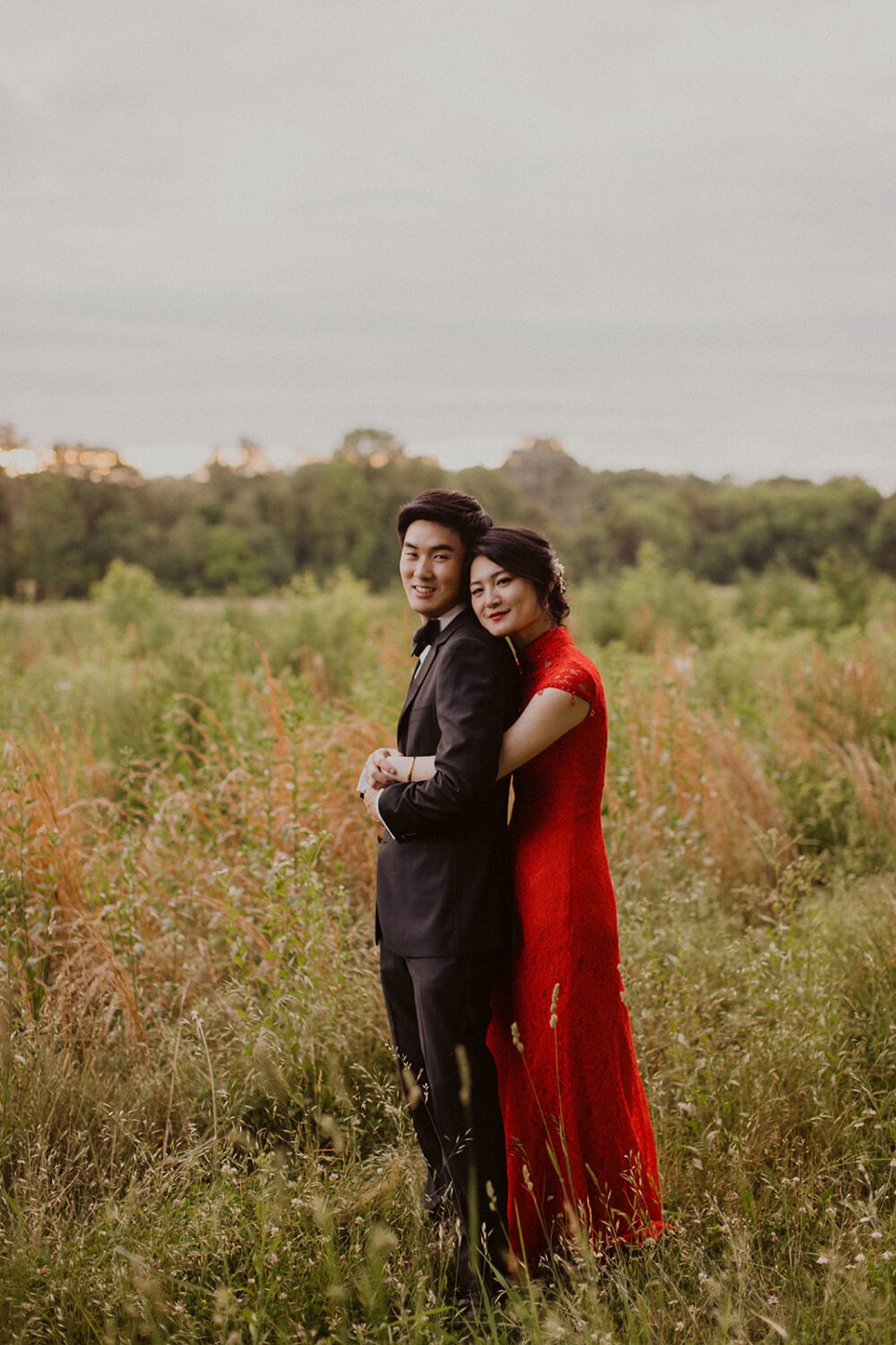 Couple embraces in meadow at Virginia wedding venue