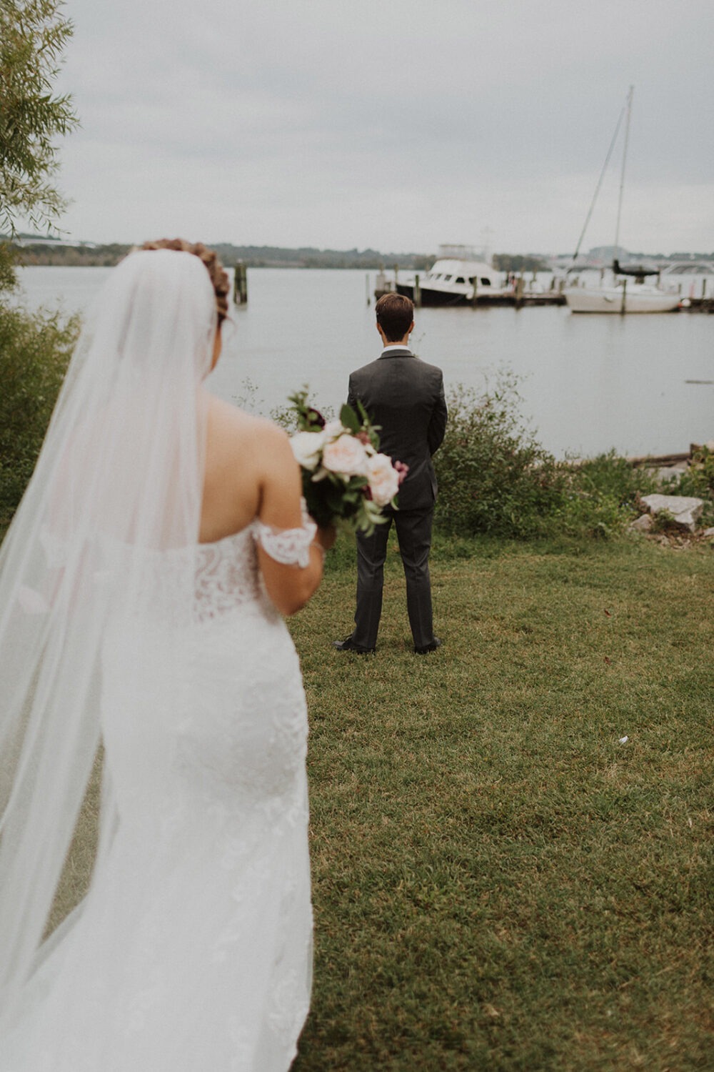 bride and groom have first look at waterfront elopement