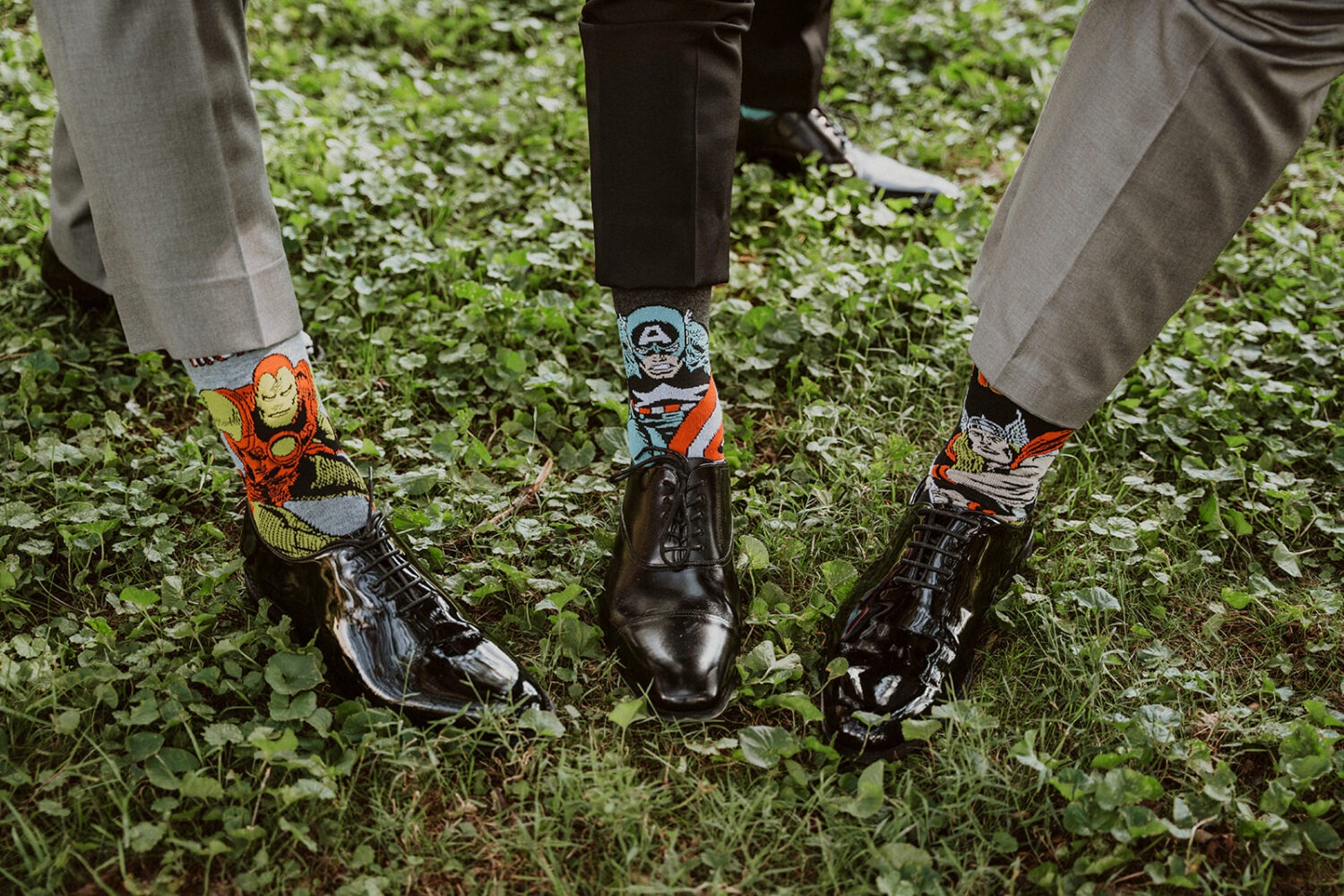 marvel socks on groomsmen as part of wedding style 