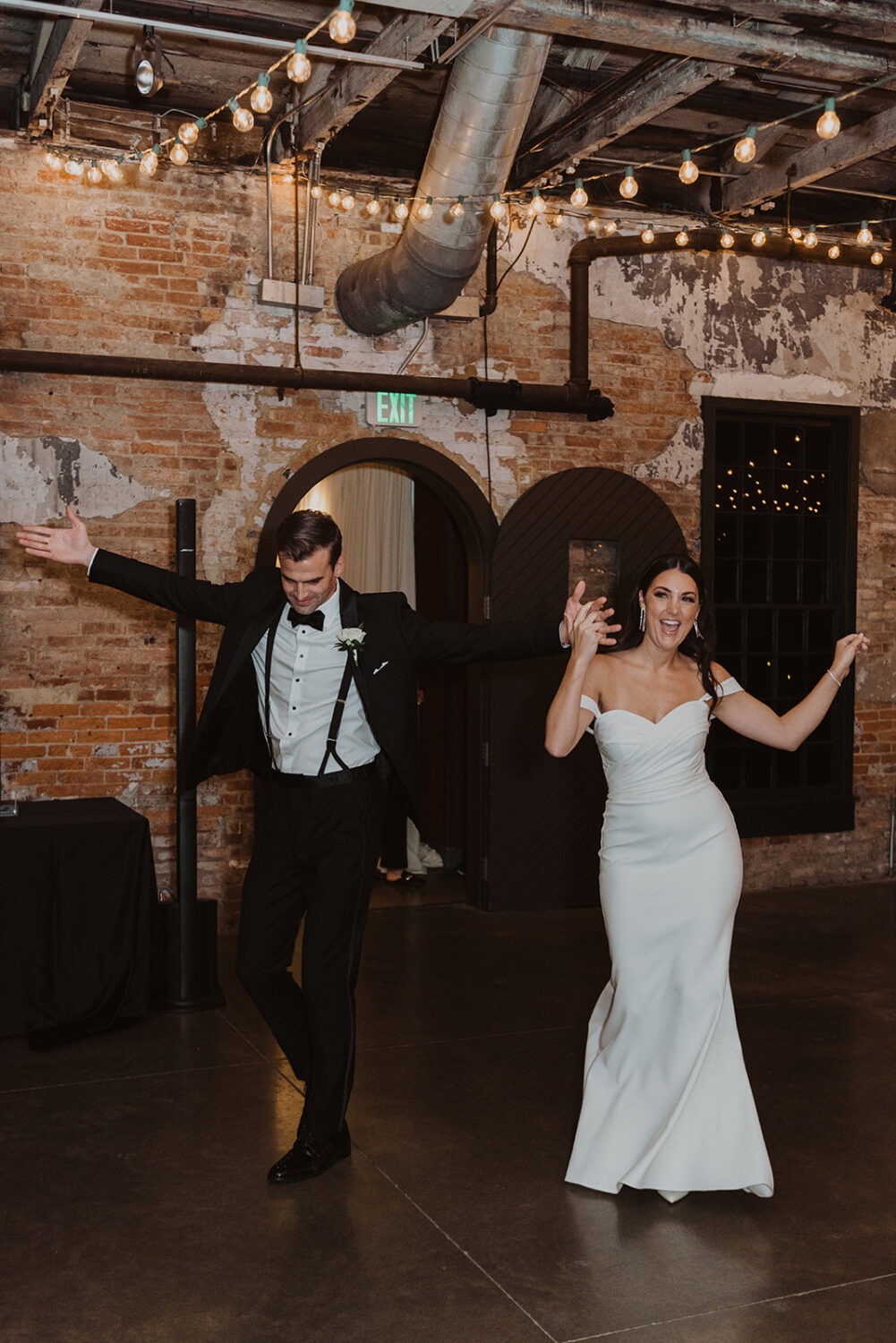couple dances entering wedding reception 