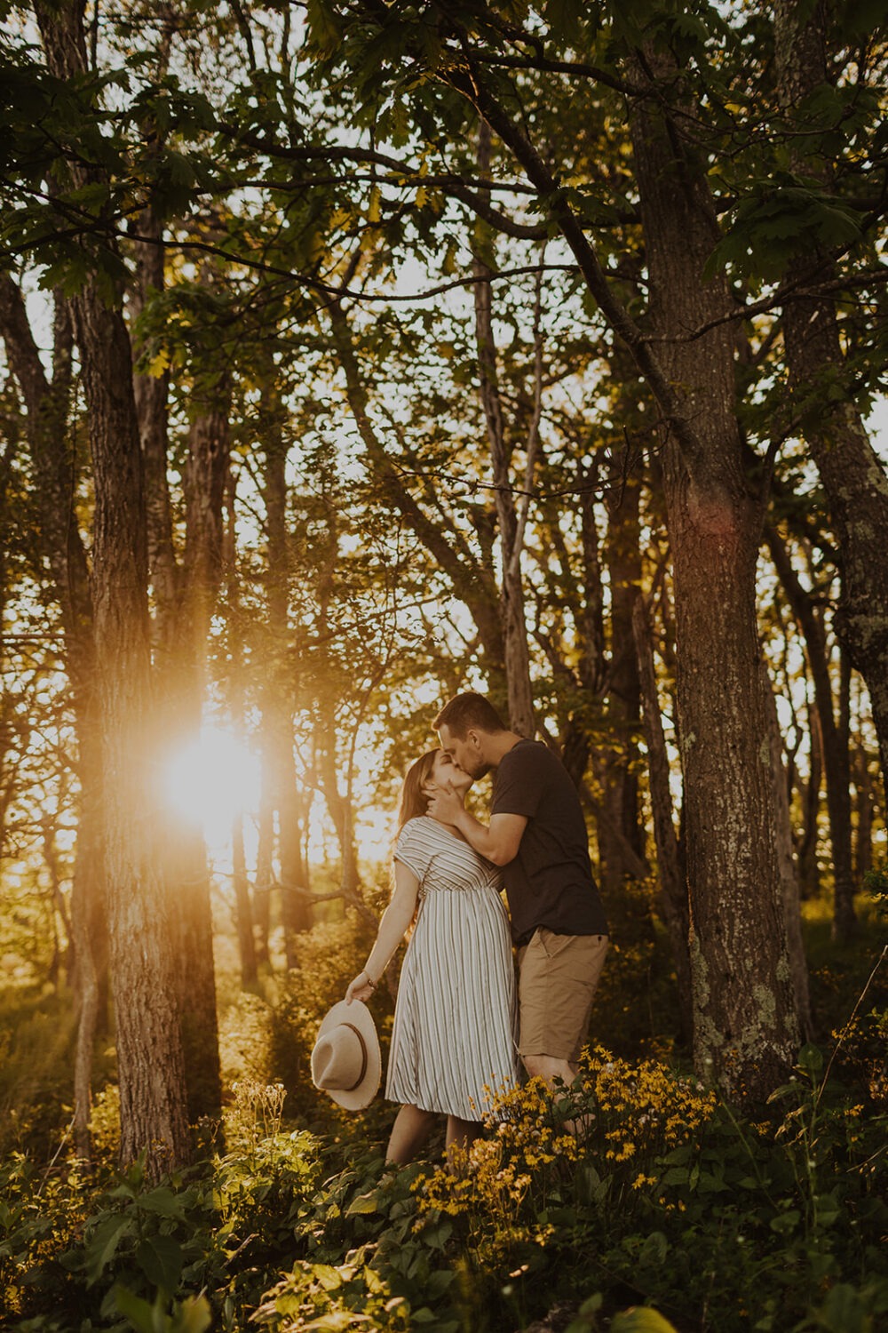 Couples kisses in sunset woods in Shenandoah National Park
