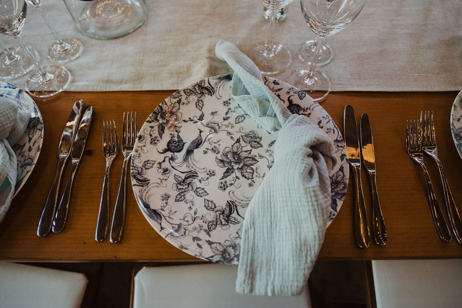 floral blue table and napkin part of barn wedding ideas at wedding venue 