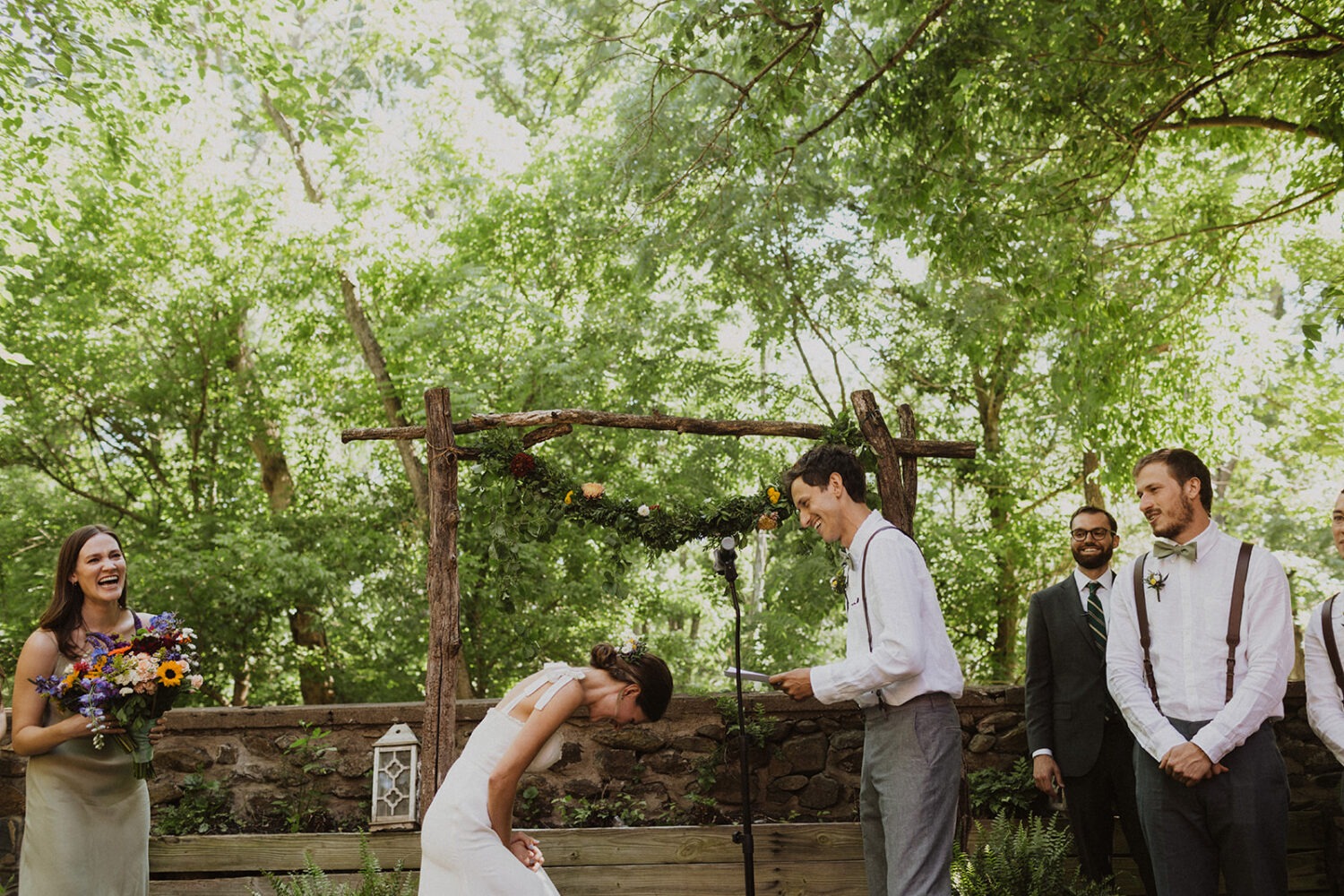 couple laughs together during wedding vows at rustic wedding 