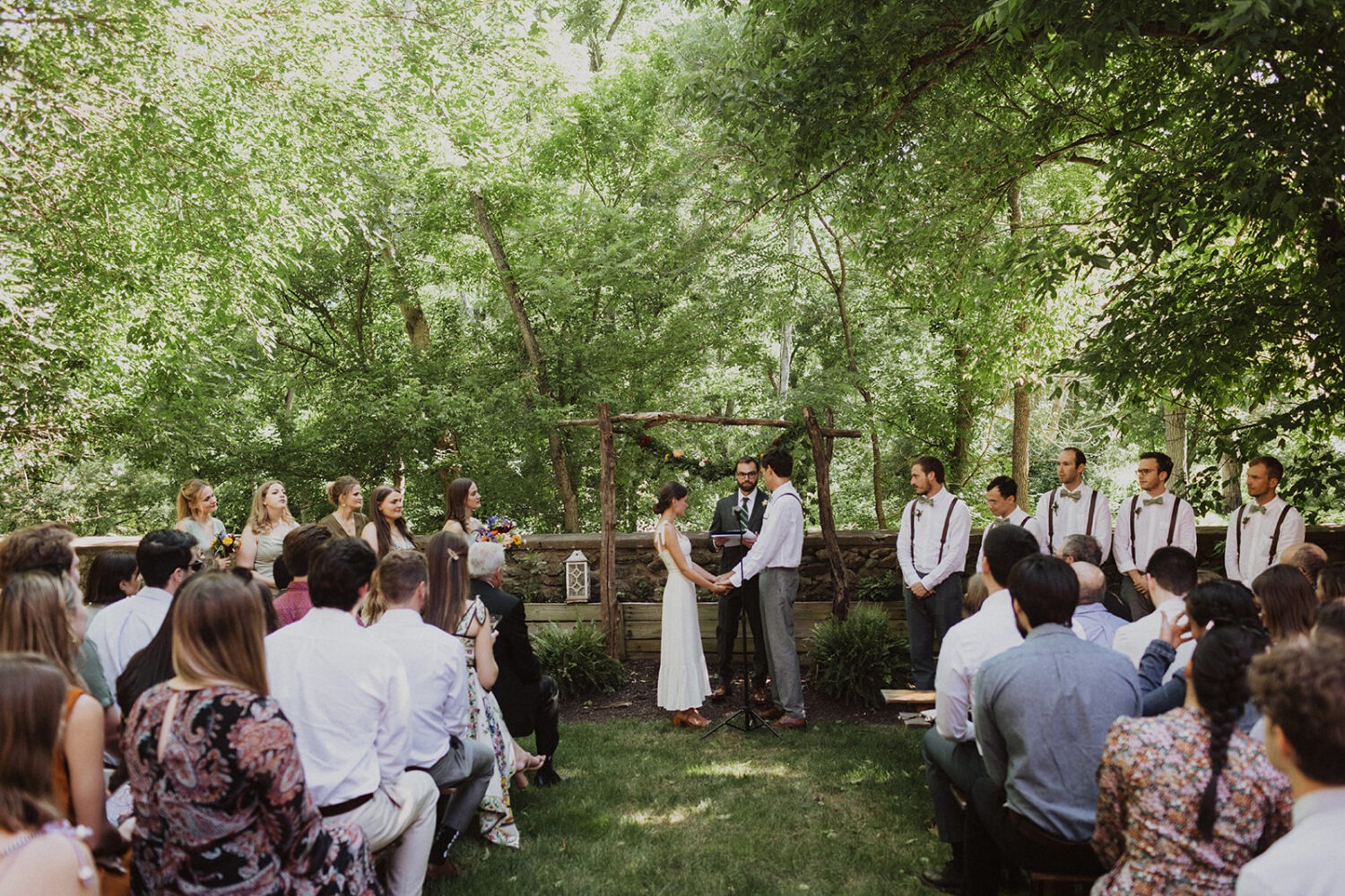 couple exchanges vows at rustic outdoor wedding 