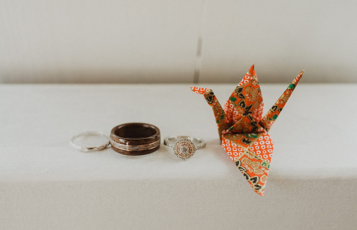 wedding rings and paper crane for summer wedding