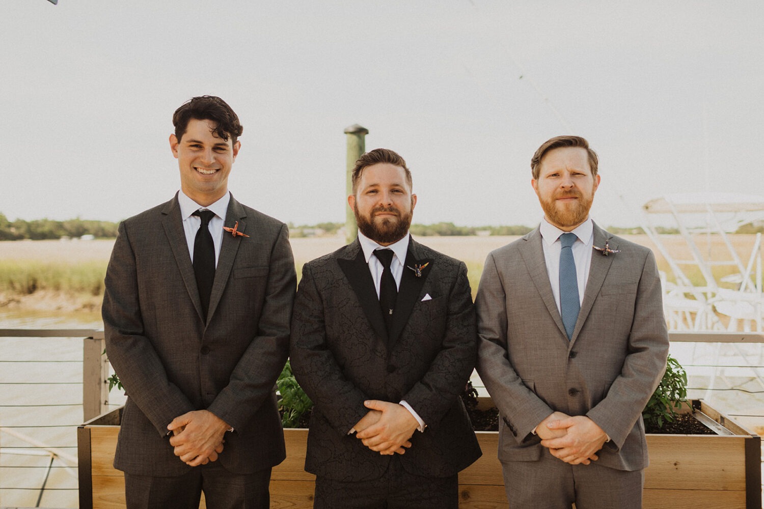 groomsmen wear paper crane boutonnieres